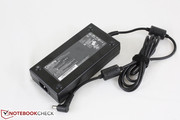 Large power adapter (17 x 8 x 3.5 cm) outputs 19 V