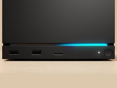 Valve Steam Machine 的正面图,配有双 USB 端口、一个 USB-C 端口、一个电源 LED、一个圆形电源按钮和一个蓝色 LED 灯带。(图片来源:Valve)