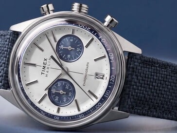 Timex Marlin Jet Chronograph photographed against a dark background, showing its domed crystal, tachymeter bezel, concave dial, chronograph subdials, and retro-futurist case design.