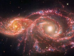 詹姆斯-韦伯太空望远镜拍摄的图像，显示两个星系 IC 2163 和 NGC 2207 正在合并。(图片来源：© NASA, ESA, CSA, STScI）