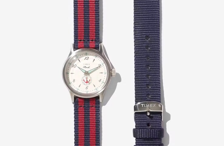 图中展示了配备红黑双色织物表带的Noah x Timex MK1 Anchor腕表，旁边还配有一条纯蓝色表带。