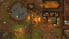 RimWorld 游戏截图,展示了一处遭受攻击的殖民地,画面中有火灾、动物和建筑。