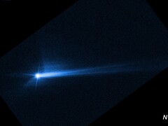 美国国家航空航天局（NASA）的 DART 航天器故意撞击迪莫弗埃后从其表面炸出的碎片（图片来源：NASA、ESA、STScI 和哈勃；经过裁剪