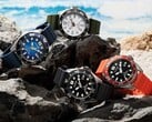 四款Citizen Promaster Marine潜水表,分别采用白色、黑色、蓝色和橙色配色,陈列在海边的岩石上。