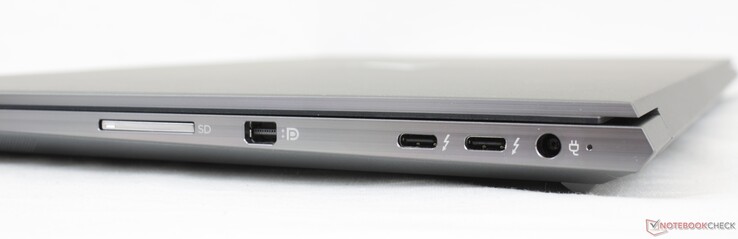右边。SD读卡器，Mini-DisplayPort 1.4，2个USB-C w/ Thunderbolt 4 PD + DP，AC适配器