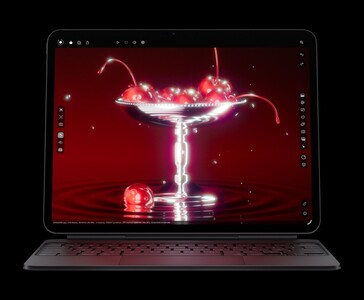 Apple 配备 Magic Keyboard 的 iPad Pro M5 显示樱桃的 3D 渲染图，展示 Ultra Retina XDR OLED 显示屏和 M5 芯片图形（图片来源：Apple)