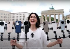 vivo X200 Ultra 荣膺变焦摄影之王。图为手持测试手机的人。(图片来源：Versus；已裁剪）