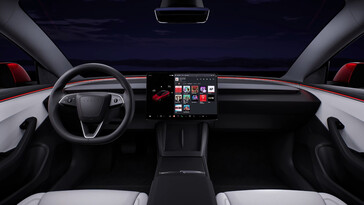 特斯拉称已对 Model 3 的材料进行了升级，并在信息娱乐屏幕下配备了双无线充电器。(图片来源：特斯拉）