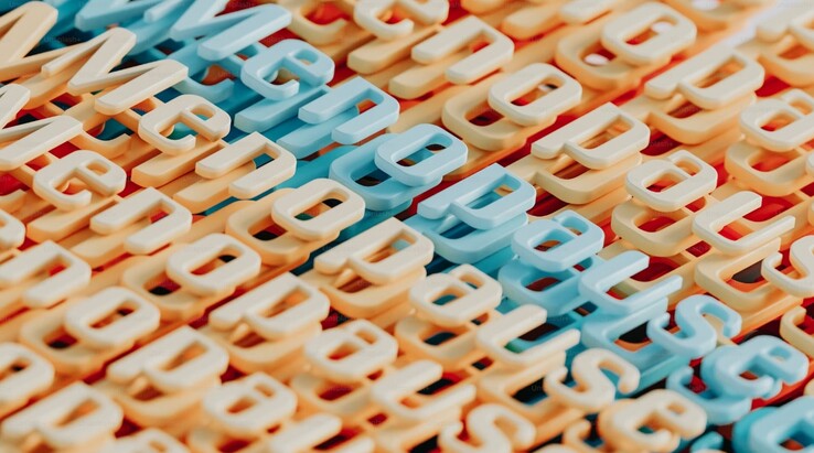 用彩色 3D 字母抽象表现更年期一词（图片来源：A.C. via Unsplash）