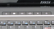 A few hot keys are found above the keyboard. Their functions from left to right: DVD eject, screen power, power settings, Mobility Center, Wi-Fi, power
