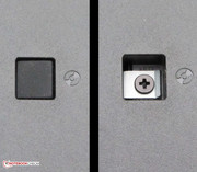 The screw of the DVD burner is beneath the rubber plug.