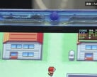 透明蓝色 FPGBA SP 掌机运行 Pokémon 的特写,可见 59.74 FPS 计数器。