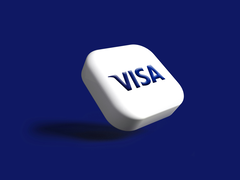 蓝色背景下的 Visa 徽标。
