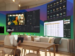 用户使用Apple Vision Pro 头戴式耳机操作虚拟桌面（图片来源：Apple)