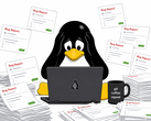 一只 Tux 型企鹅被人工智能生成的错误报告淹没在 Linux 开发人员的工作区。