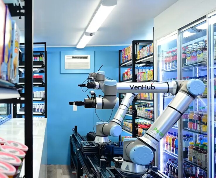 Venhub 商店使用两台人工智能机器人，在长长的金属轨道上全天候为顾客提供服务。(图片来源：Venhub）