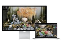 与 MacBook 一起使用的原版 Studio Display 渲染图。(图片来源：Apple)